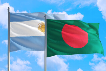 Bangladesh and Argentina national flag waving in the windy deep blue sky. Diplomacy and international relations concept.