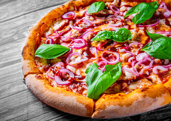 Pizza with chicken and barbeque sauce . Italian pizza on wooden table background