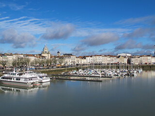 Obraz premium La Rochelle, Charente Maritime, France. Cityscape of La Rochelle on sunny day. Famous for its fort and harbor.French city and seaport located on the Bay of Biscay, a part of the Atlantic Ocean