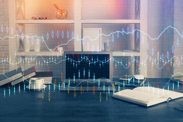 Financial graph colorful drawing and table with computer on background. Double exposure. Concept of international markets.