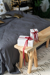 Present box on wooden bench in bedroom
