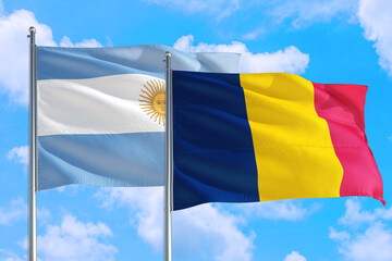 Chad and Argentina national flag waving in the windy deep blue sky. Diplomacy and international relations concept.