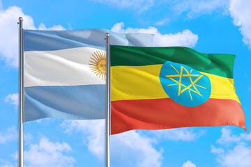 Ethiopia and Argentina national flag waving in the windy deep blue sky. Diplomacy and international relations concept.