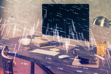 Double exposure of chart and financial info and work space with computer background. Concept of...