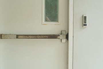 Close-Up a arm opener the fire door of the building.