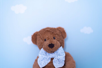teddy bear on blue sky wallpaper with white clouds