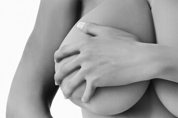 Woman with big bust covers her breast black and white