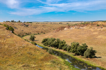 View of the river Vorgol and the surrounding landscape from the top of the cliffs. Tourist and rock climbing place near the city of Yelets, Lipetsk region, Russia
