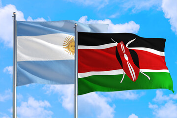 Kenya and Argentina national flag waving in the windy deep blue sky. Diplomacy and international...