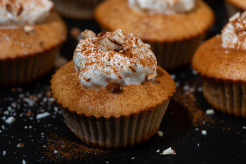 portioned mini cakes with whipped cream, closeup