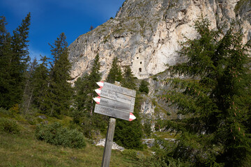 Signs used in trekking to indicate the routes in the dolomites at wolkenstein castle in the rocks