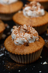 portioned mini cakes with whipped cream, vertical