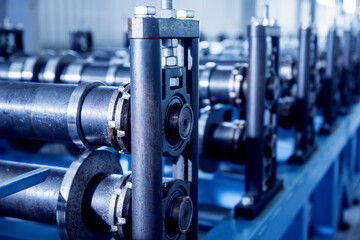 Metal sheet forming machine at the modern metalwork factory.