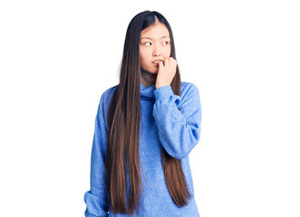 Young beautiful chinese woman wearing casual turtleneck sweater looking stressed and nervous with...