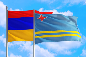 Aruba and Armenia national flag waving in the windy deep blue sky. Diplomacy and international relations concept.