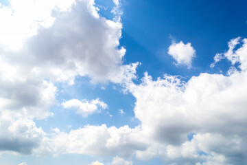 Naklejka na ściany i meble Blue sky with white soft clouds