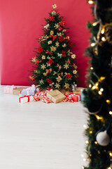 Christmas tree pine with gifts decor interior of the house new year