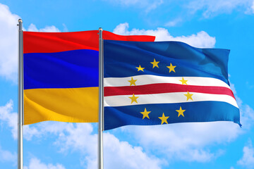 Cape Verde and Armenia national flag waving in the windy deep blue sky. Diplomacy and international relations concept.