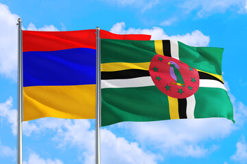 Dominica and Armenia national flag waving in the windy deep blue sky. Diplomacy and international relations concept.
