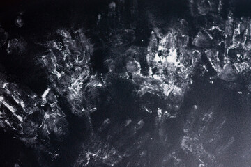 Handprints on a dark background. Close up