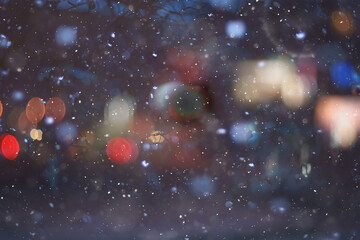 abstract snow blurred background city lights, winter holiday new year