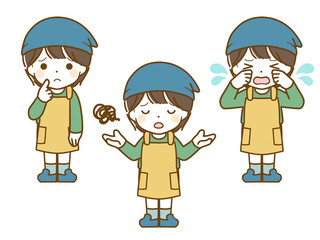 エプロンを着た男児の困った表情