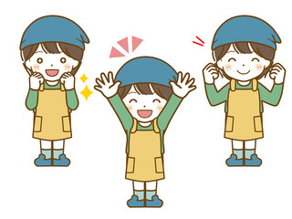 エプロンを着た男児の楽しい表情