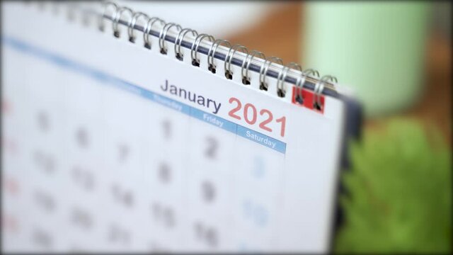 Close up of calendar Changing from December 2020 to January 2021 - concept of beginning or starting of new year 2021