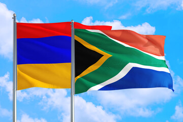 South Africa and Armenia national flag waving in the windy deep blue sky. Diplomacy and international relations concept.