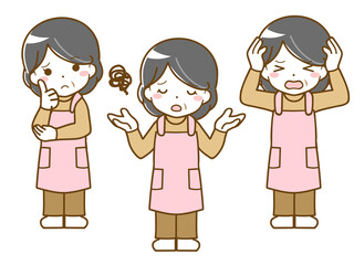 エプロンを着た中年女性の困った表情