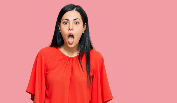 Beautiful young woman wearing casual clothes afraid and shocked with surprise and amazed expression, fear and excited face.