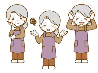エプロンを着た老年女性の困った表情