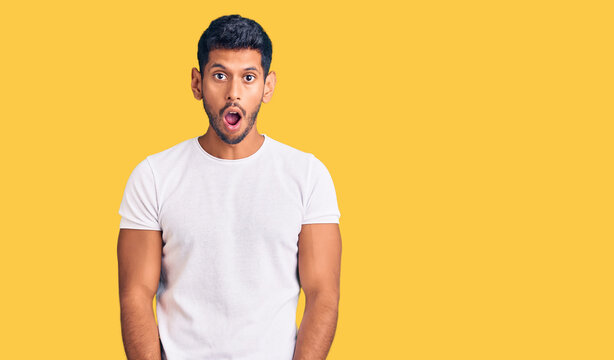 Young latin man wearing casual clothes afraid and shocked with surprise and amazed expression, fear and excited face.