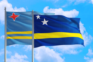 Curacao and Aruba national flag waving in the windy deep blue sky. Diplomacy and international relations concept.