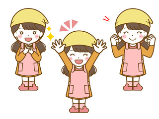 エプロンを着た女児の楽しい表情