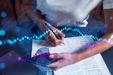 Fototapeta premium Forex chart drawing and a woman signing contract use phone. Multiexposure. Financial analysis concept.