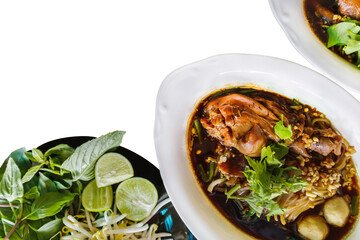 Delicious chicken legs with noodles and broth isolated on white background with clipping path.