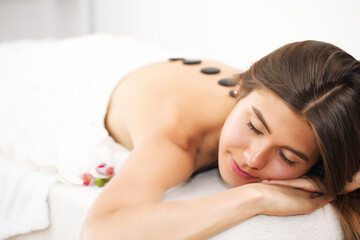Obraz na płótnie Canvas Young beautiful woman receiving spa treatment in spa beauty salon. Wellness massage. Beauty salon.