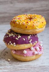 Stacked Glazed Donuts.
 A Pile Of Colorful Donuts.