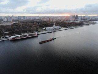 Naklejka premium Aerial view panoramic cityscape river port with ships in the center of the big city at dawn. North River Station. Moscow. Russia