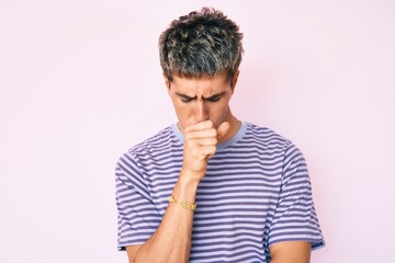 Fototapeta na wymiar Young handsome man wearing casual clothes feeling unwell and coughing as symptom for cold or bronchitis. health care concept.
