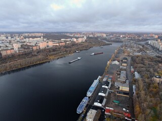 Obraz premium Aerial view panoramic cityscape with great height. River in a big city from a drone