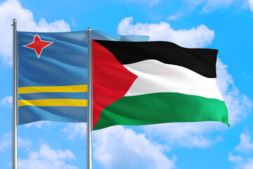 Palestine and Aruba national flag waving in the windy deep blue sky. Diplomacy and international relations concept.