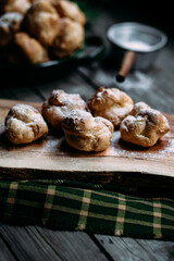 Profiteroles with custard on the table