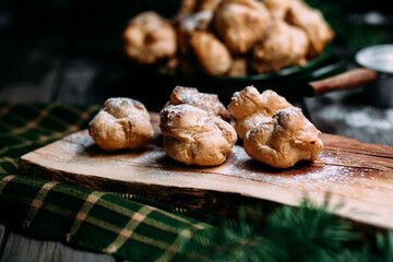 Profiteroles with custard on the table