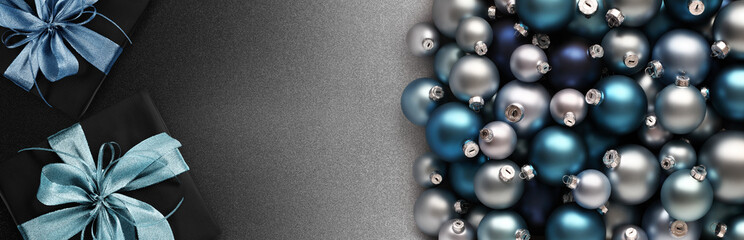 merry christmas, top view of wrapped gift present packages and blue balls, isolated on black background, useful as a greeting gift card