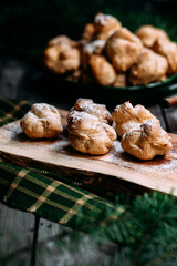 Profiteroles with custard on the table
