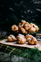 Profiteroles with custard on the table