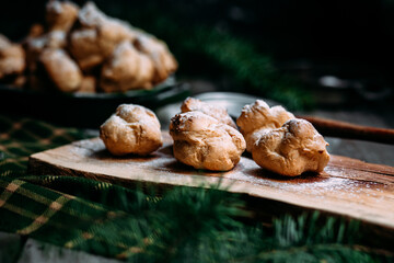 Profiteroles with custard on the table