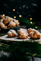 Profiteroles with custard on the table